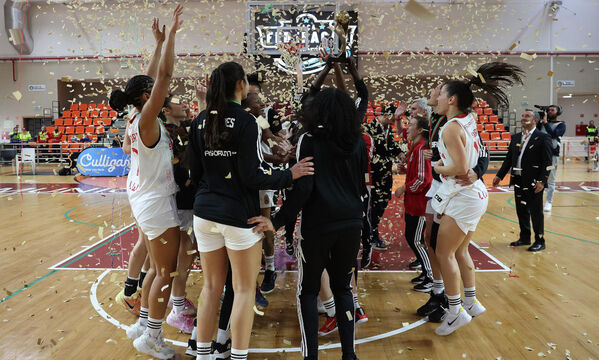 The team celebrating with the trophy